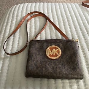 Mk crossbody brown bag with beautiful MK gold plate